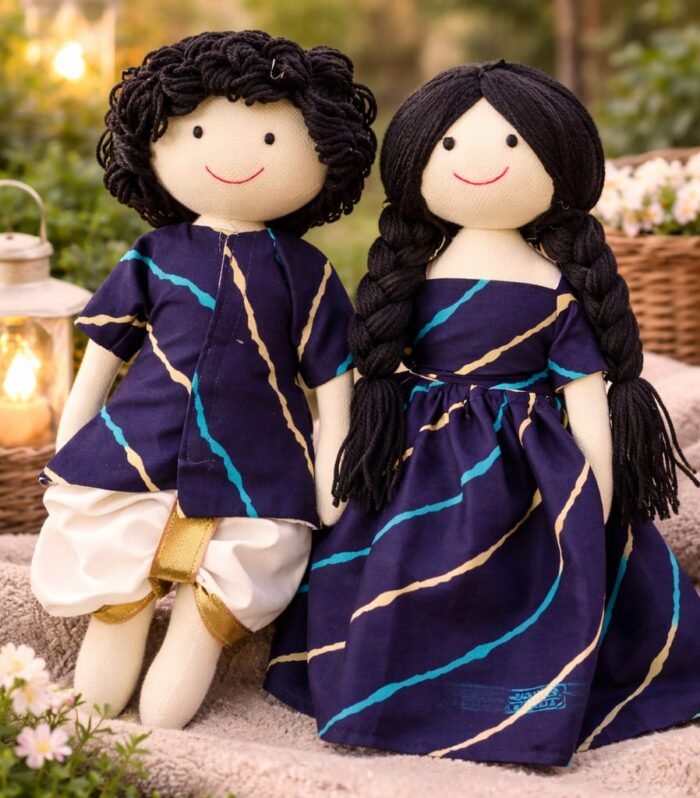 Two dolls in blue festive wear
